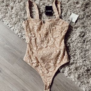 Tan lace body suit
